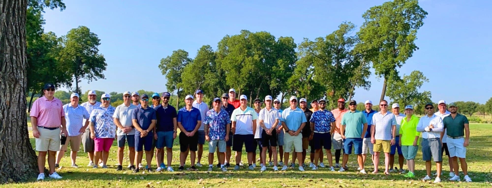 The Double Bogey field lined up before a round